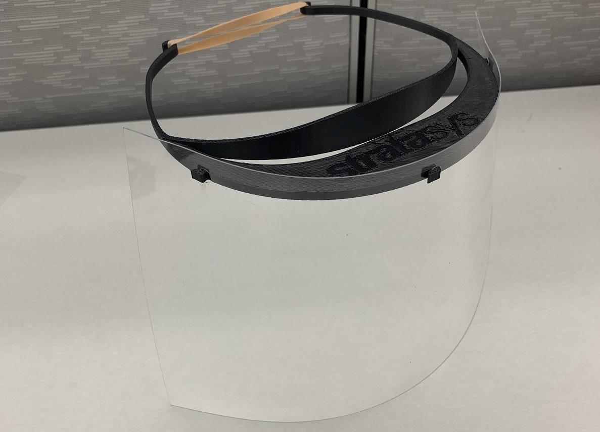 Stratasys is producing thousands of face shields—including both a 3D printed visor and a clear plastic—at no cost to recipients. (Credit: Stratasys)