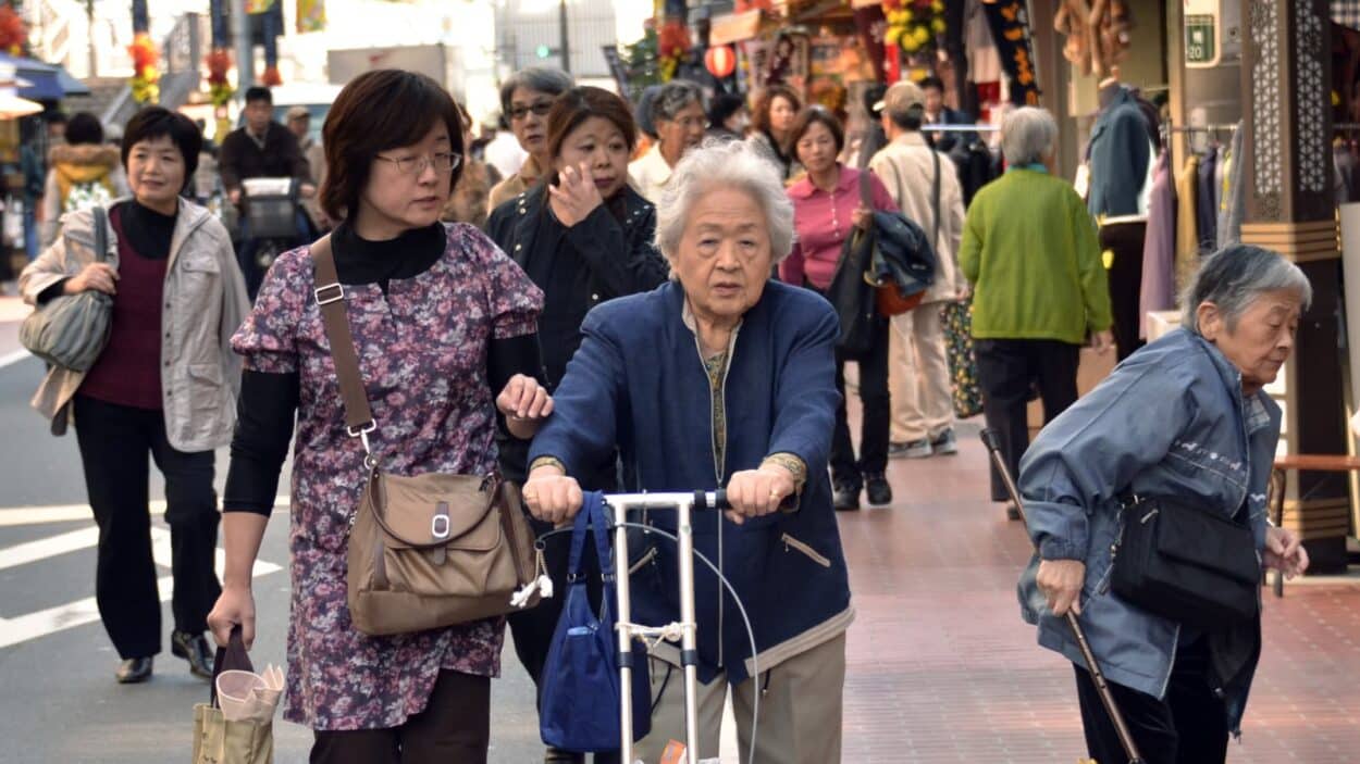 Elderly people stroll down a shopping precinct in Tokyo. (Credit: Yoshikazu Tsuno | AFP | Getty Images)