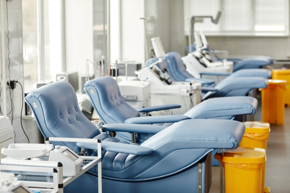 Med chairs in row at modern blood donation center. Image via Envato.